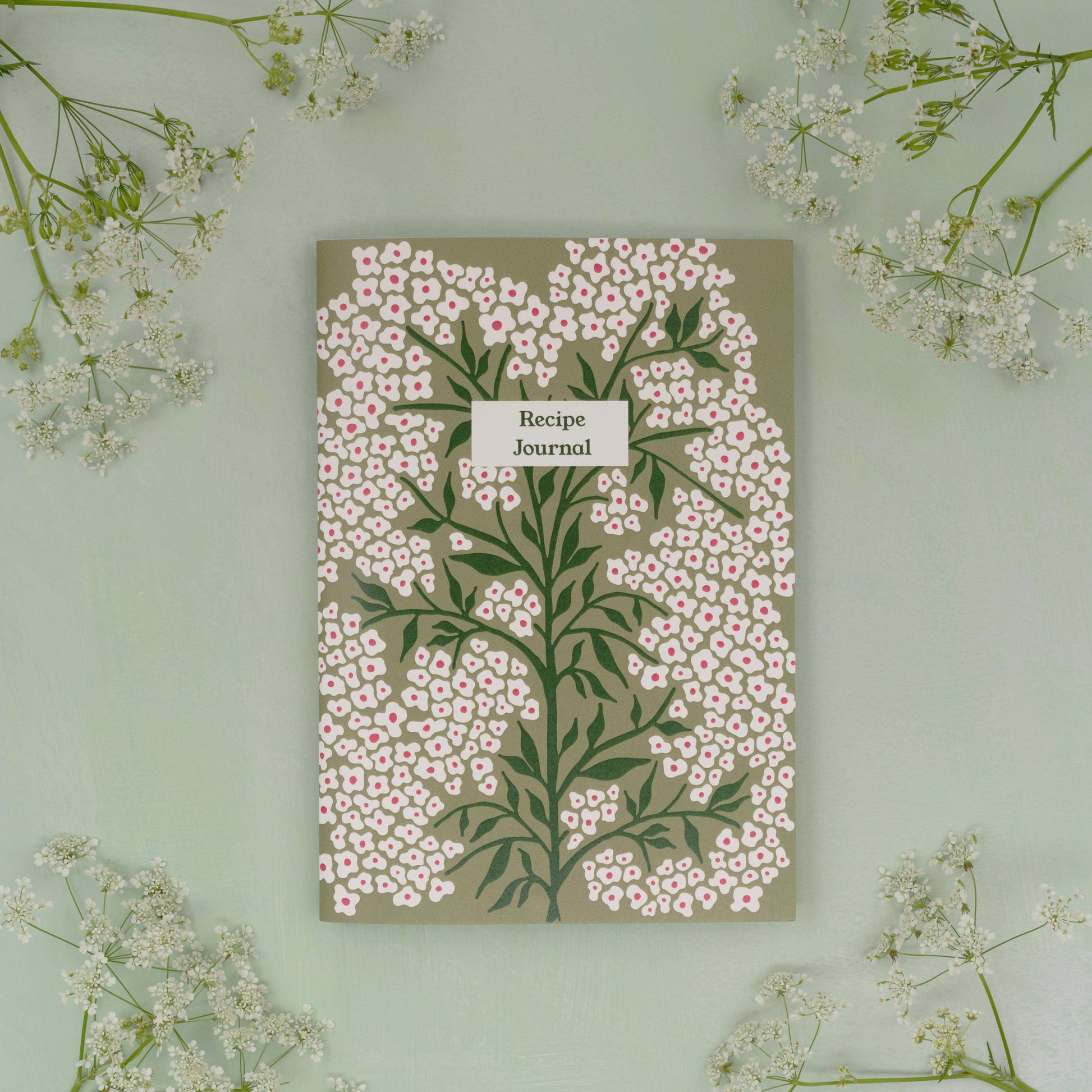 Pages are designed to layout ingredients and method as well as space to draw pictures, staple photos etc. Also includes a namesake page and handy weights and measurements page at the back. Supplied with Bookmark.