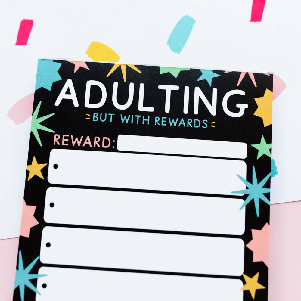 Close-up of tear-off sheets on Adulting With Rewards notepad