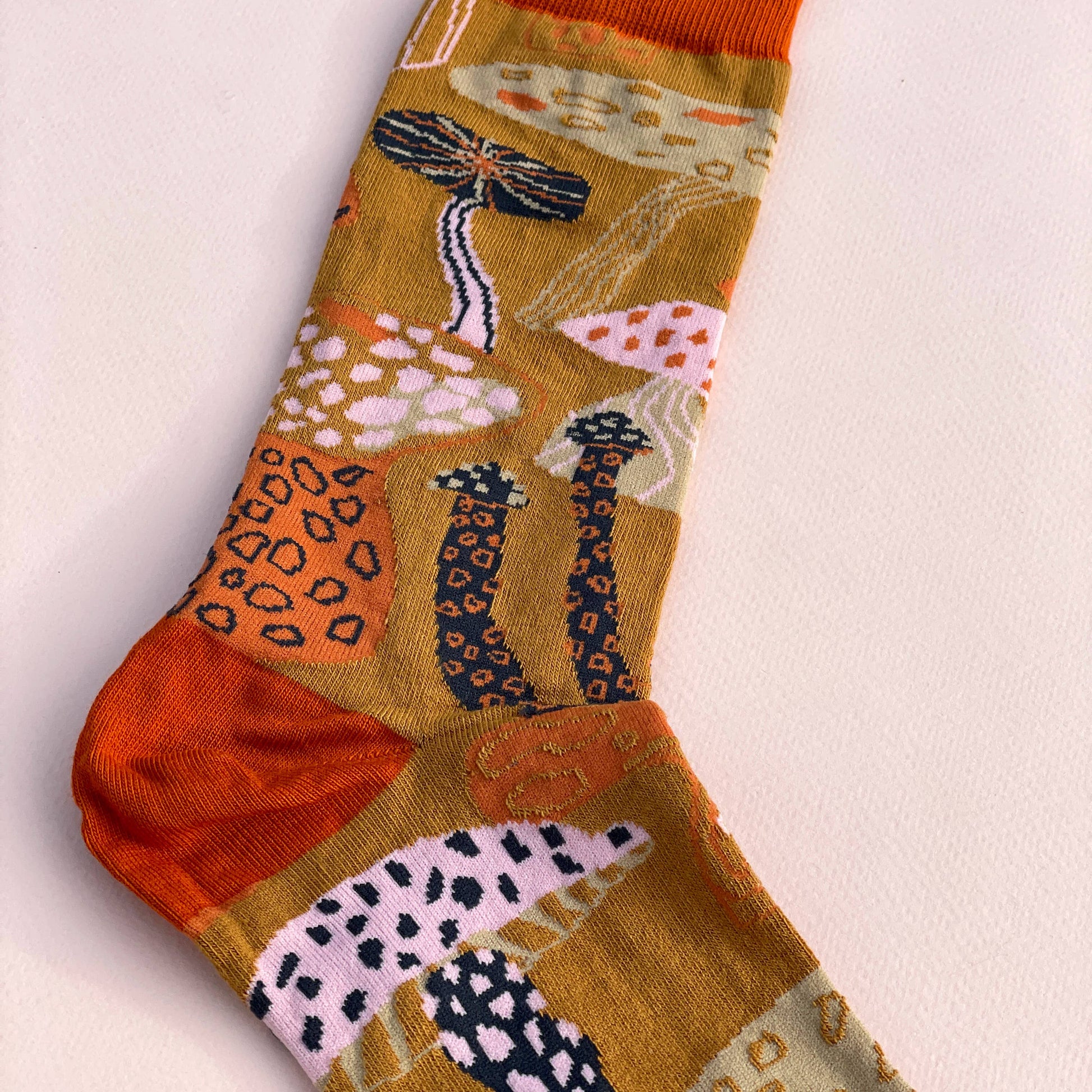 James Barker Mushroom socks in five colours, illustrated nature pattern, made from combed cotton.