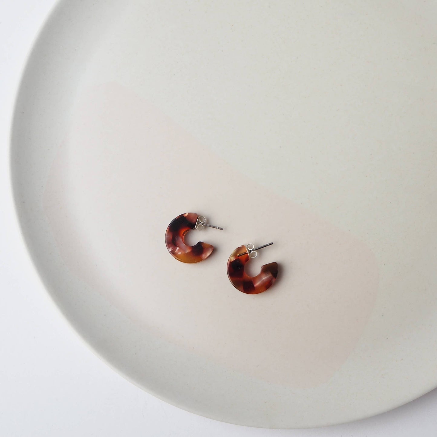 Side view of 1.8cm mini hoop earrings