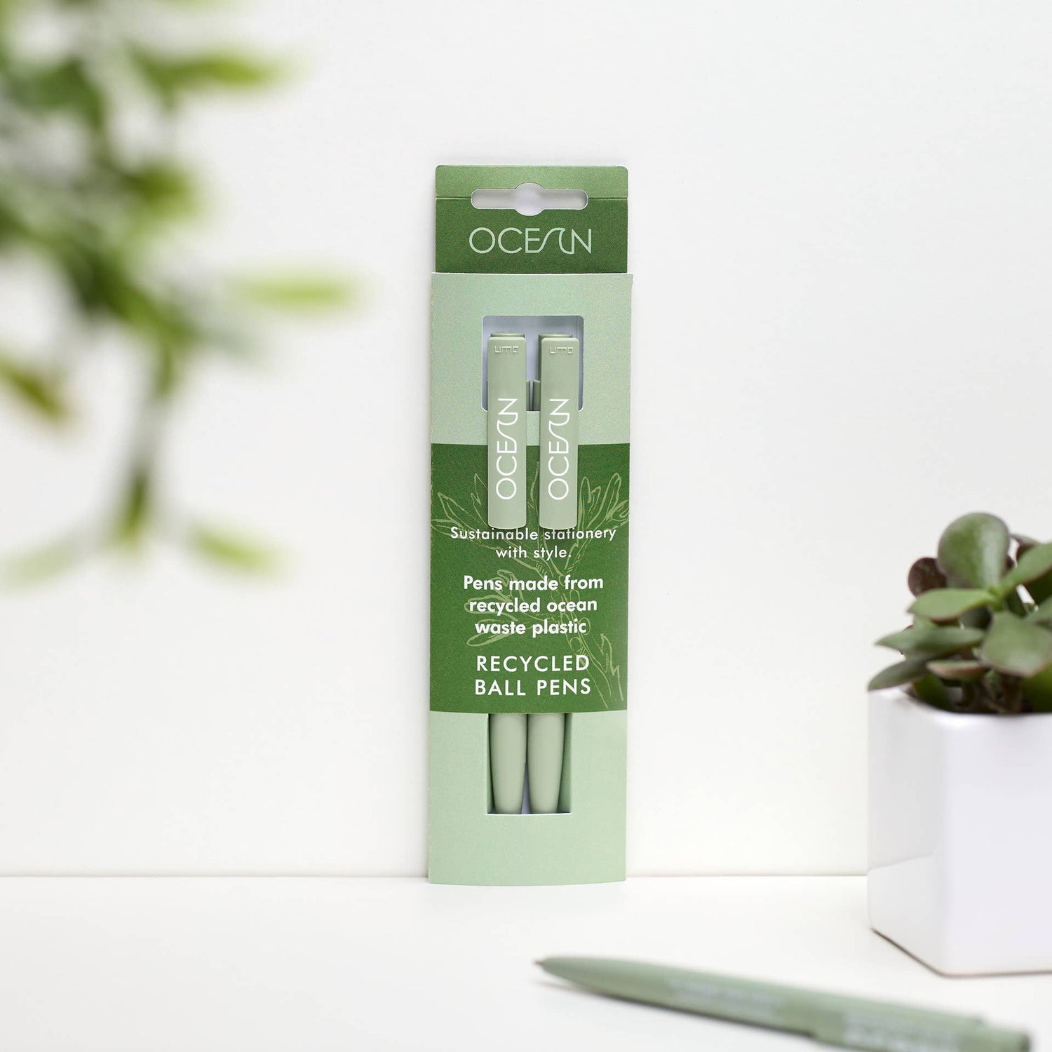 Close-up of a single recycled ocean plastic pen in Algae Green, showing the 'OCEAN' clip detail.