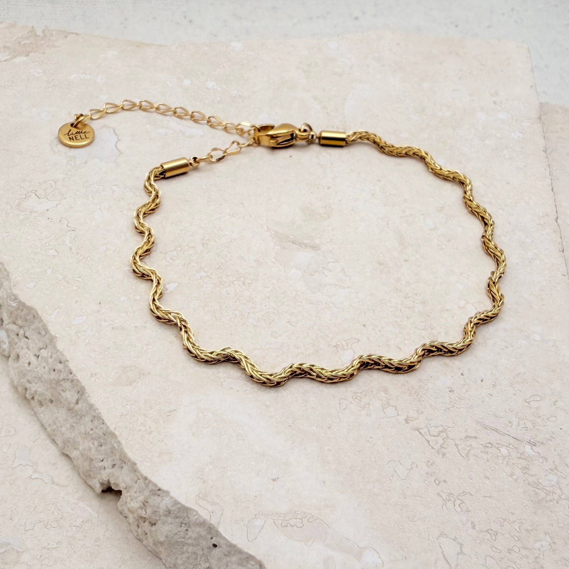 Everyday Gold Wavy Bracelet layered with other gold bracelets