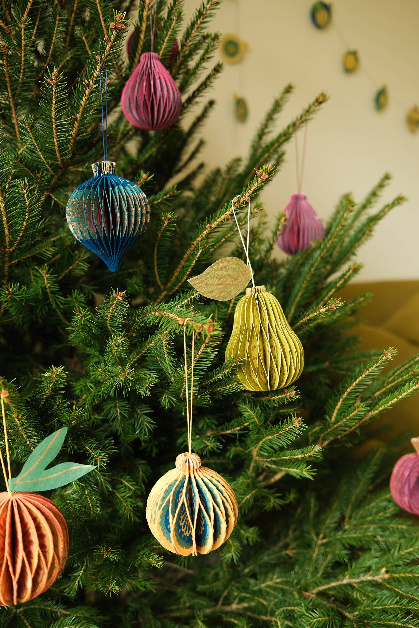 Screen printed pattern detail on sustainable pear honeycomb ornament