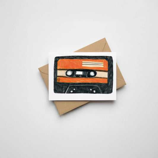 A mini card featuring illustration of a retro music cassette tape. Designed and Printed in the UK. A7. Comes with a kraft envelope.