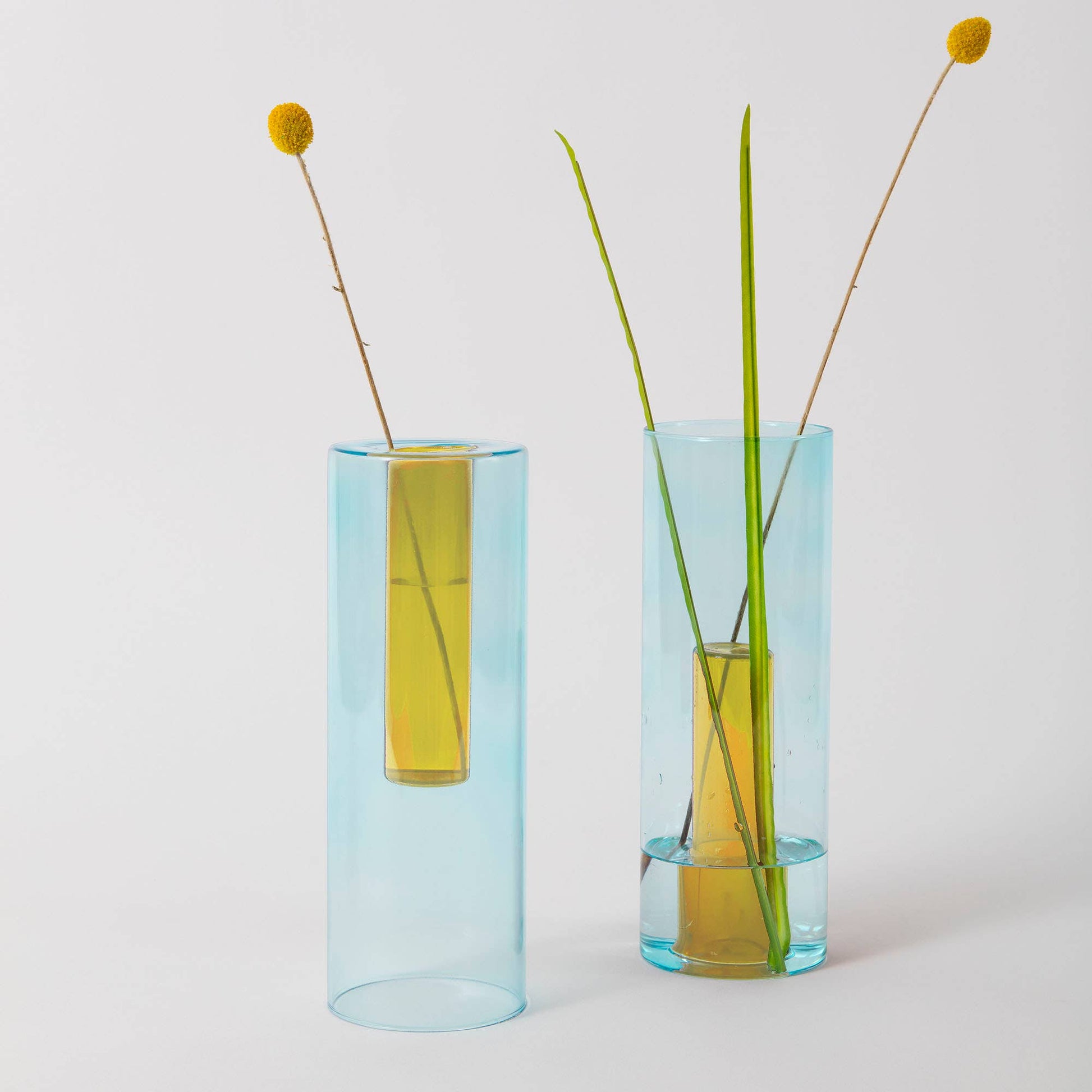 Reversible glass vase used as a single stem bud vase