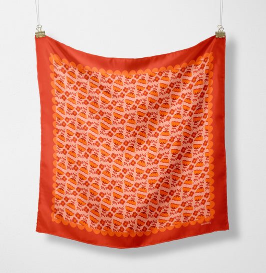 Eco silk twill pocket square with orange folk flower pattern and scalloped border, cottagecore style. Made from recycled polyester and designed by Su Owen.