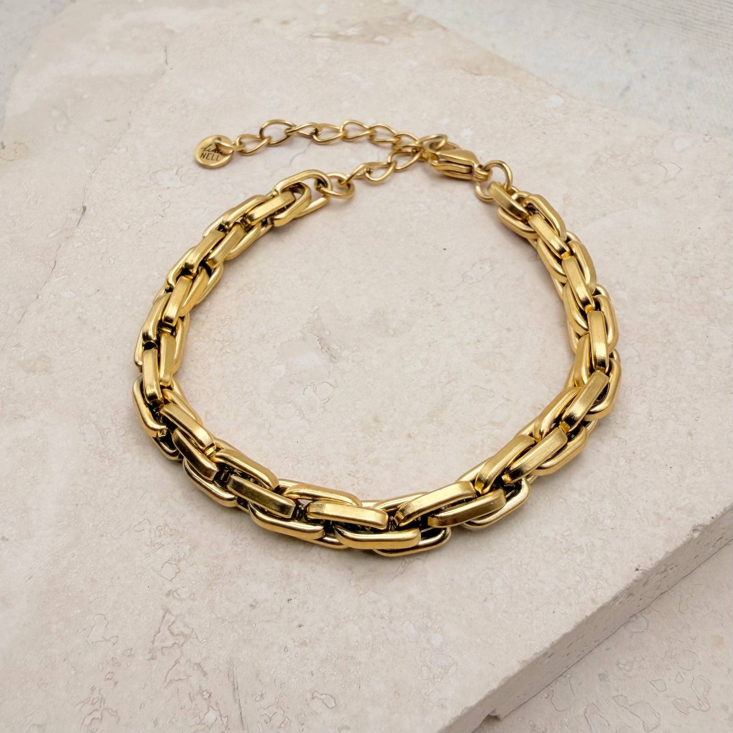Gold plated box chain bracelet on a white background