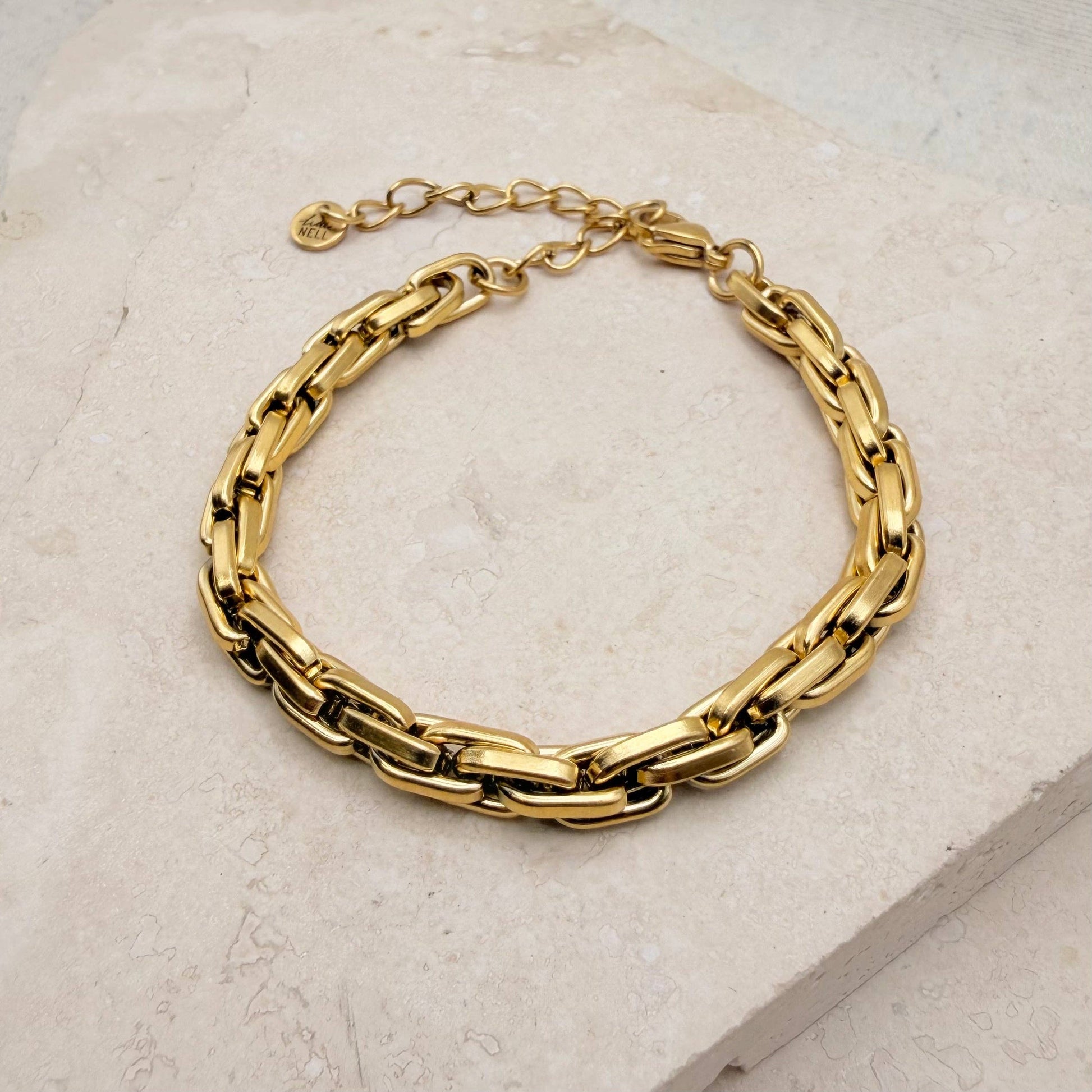 Gold plated box chain bracelet on a white background