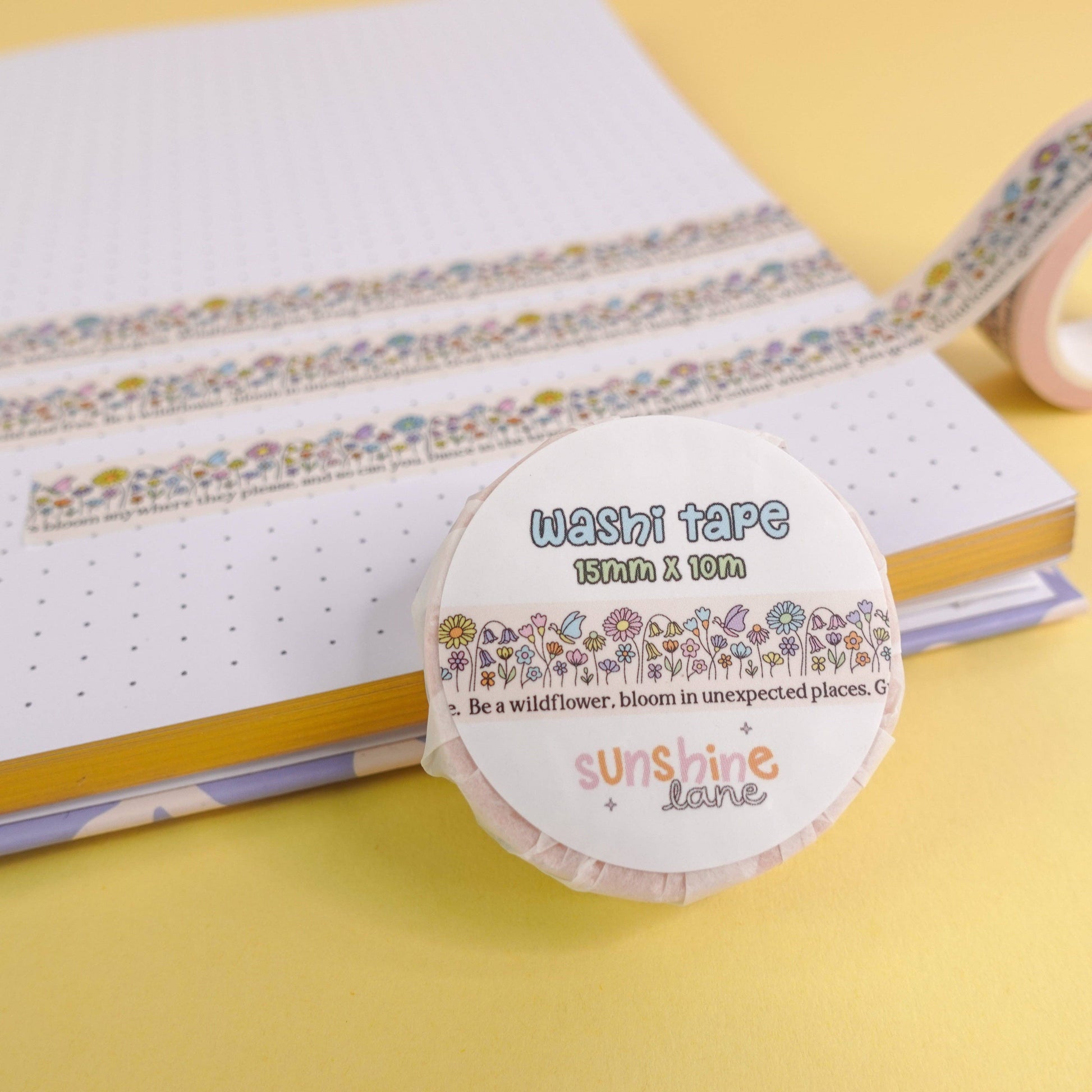 Roll of 'Be a Wildflower' Washi Tape in its recyclable, eco-friendly paper packaging, highlighting sustainable stationery.