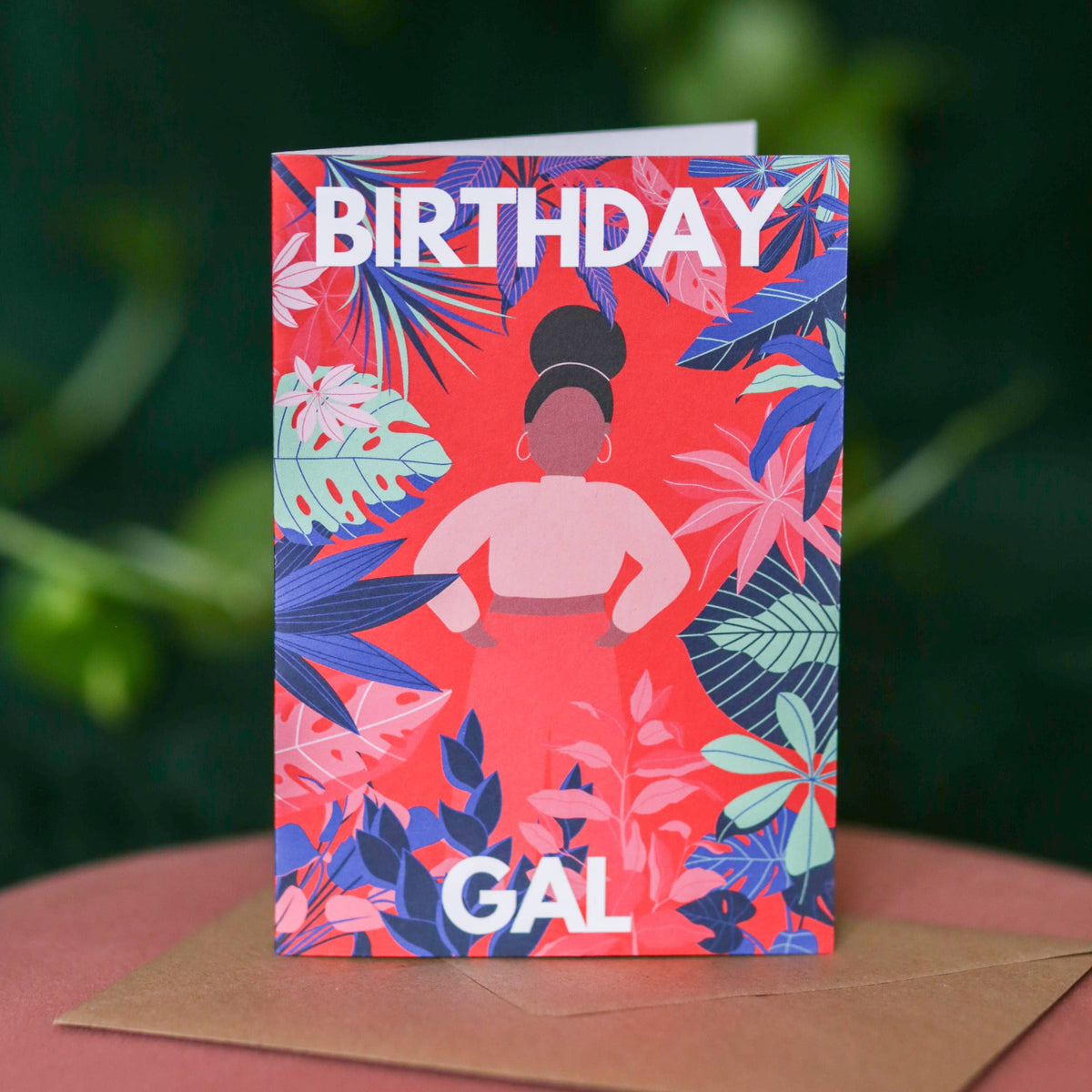 Diverse birthday card featuring a Black girl and vibrant green plants