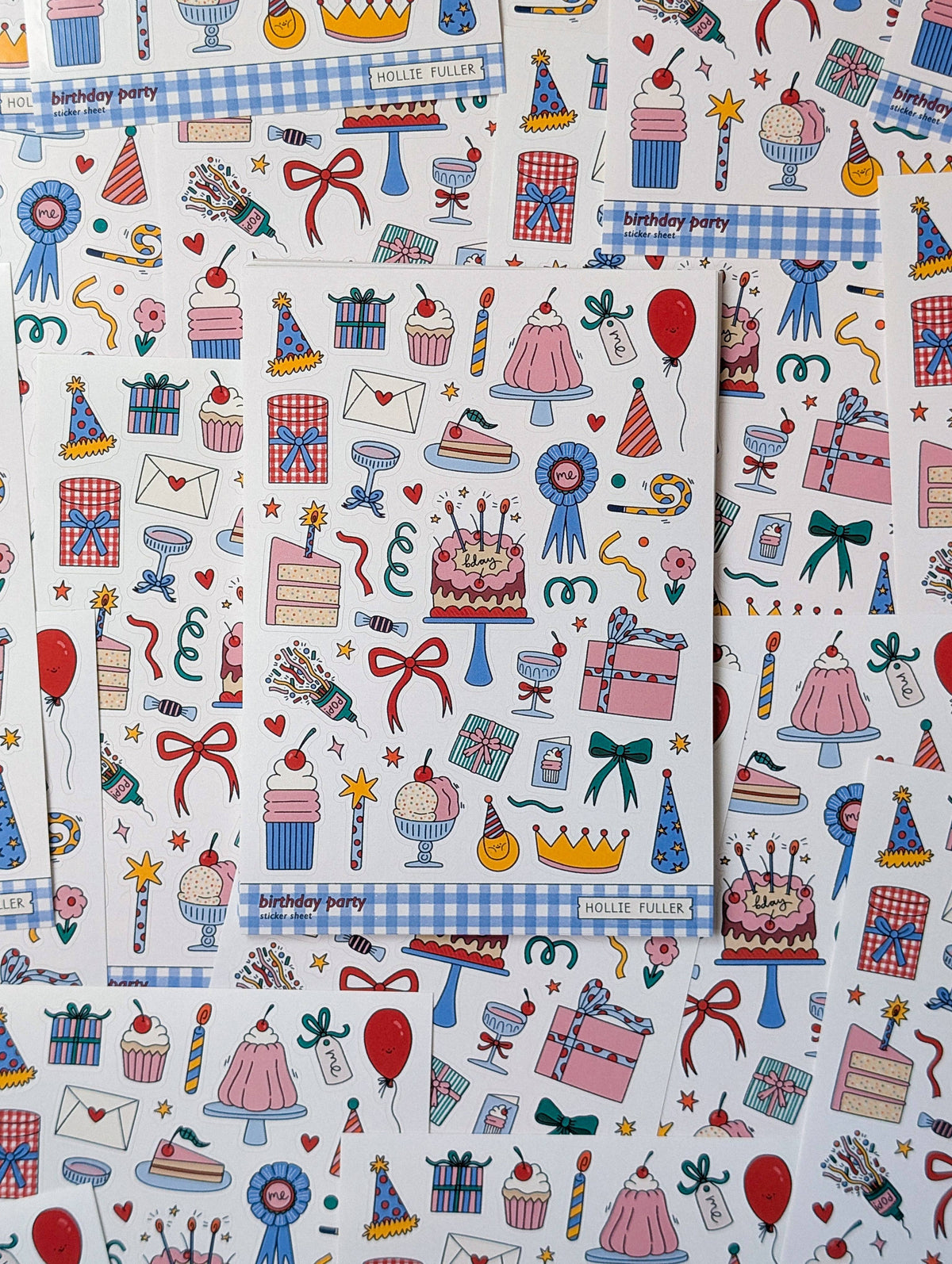 Close-up of waterproof vinyl birthday stickers featuring cake, presents, and party hats