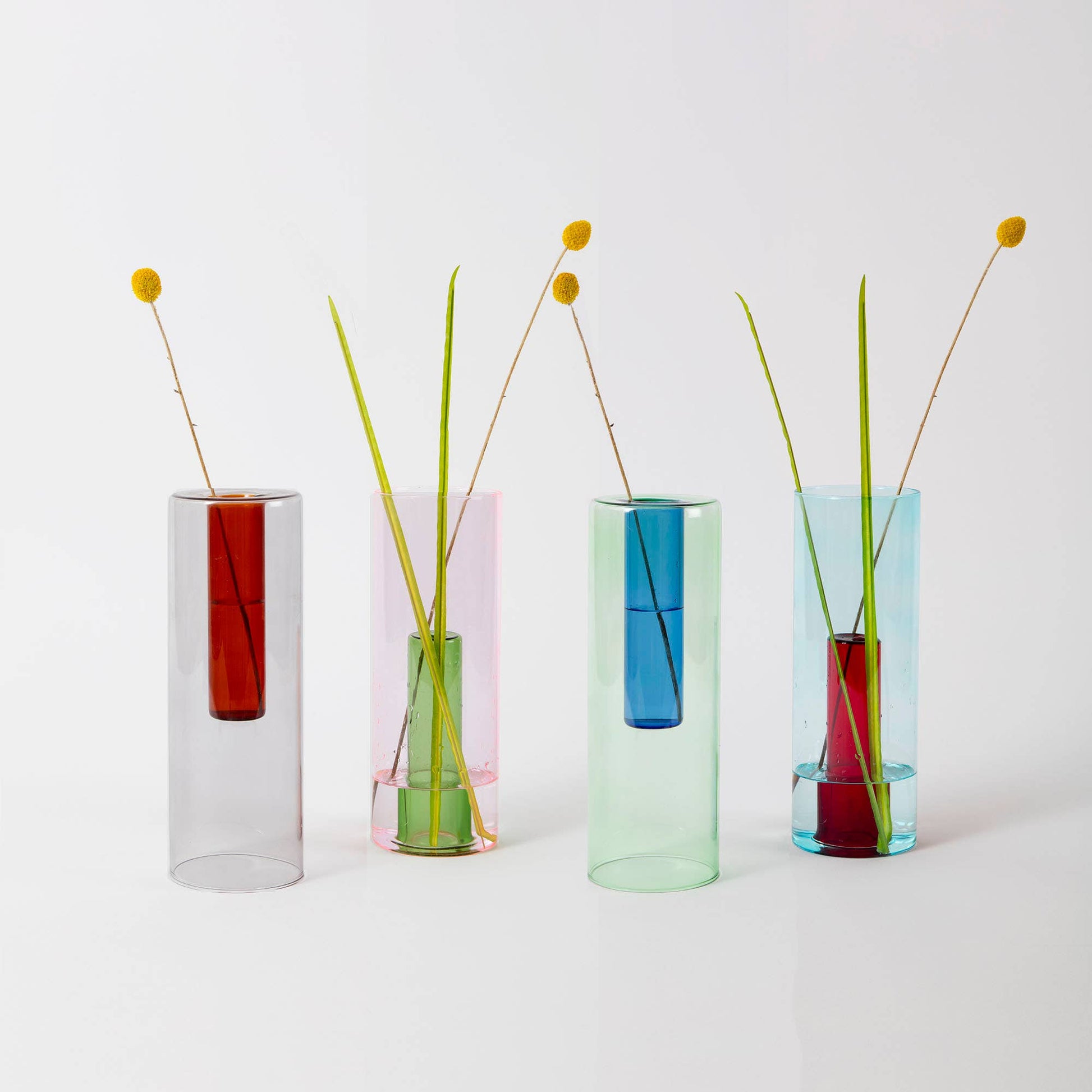 Reversible glass vase used as a single stem bud vase