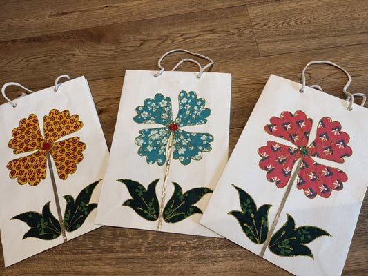Handcrafted in India, gift bags made of sari material.