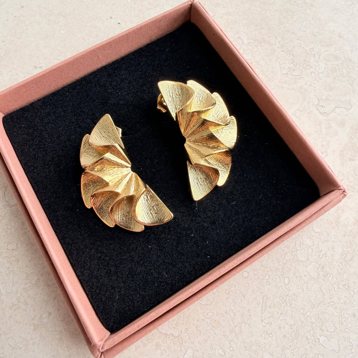 Close-up of Everyday Ruffle Earrings with butterfly back