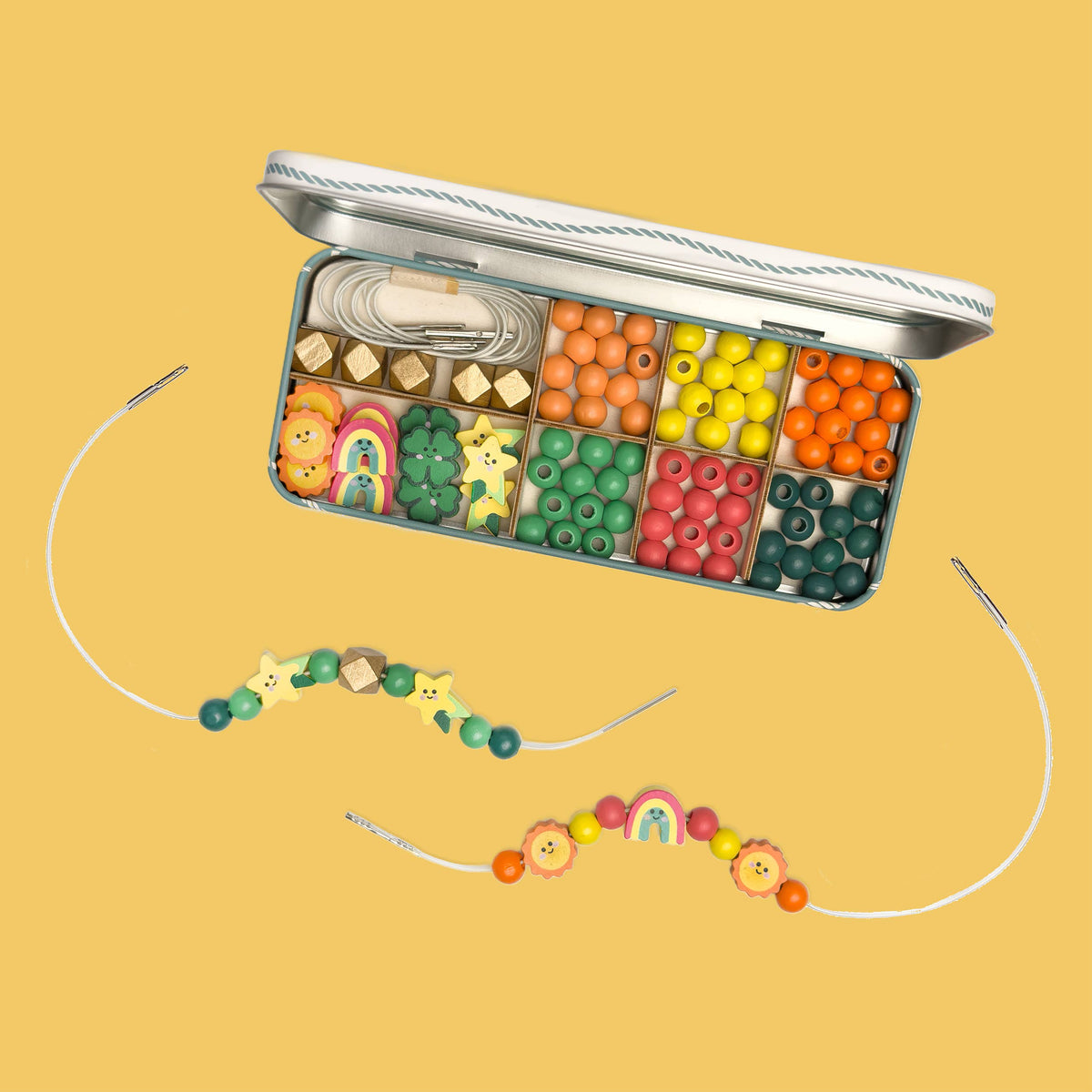 Detail of metal-ended elastics for easy threading in the kids beading kit