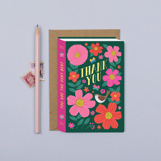 Express your gratitude with elegance and charm with this delightful Thank You Card, shaped like a book and adorned with vibrant flowers and a sweet bird motif. The intricate floral design, accented by the presence of a whimsical bird, adds a touch of natural beauty and serenity to your heartfelt message of thanks.