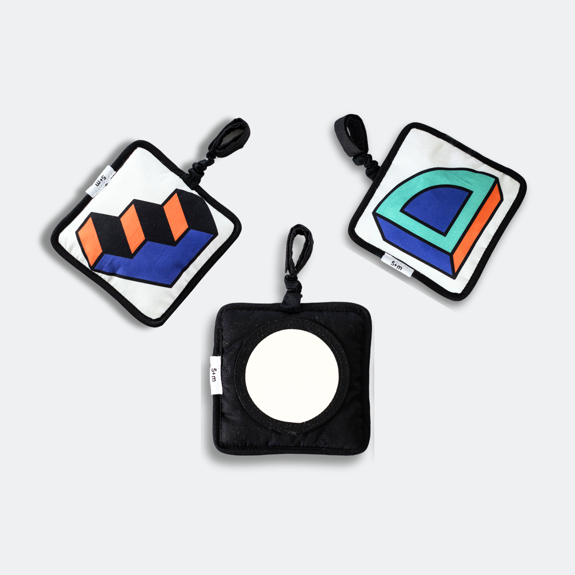 Close-up of Etta Loves x Walala reversible sensory patterns for 0-4 and 5+ months