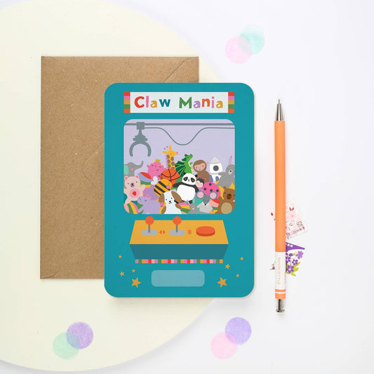 Mifkins Claw Machine birthday card shaped like arcade machine with toy prizes and bright colours. Kraft envelope, sustainably made in the UK.
