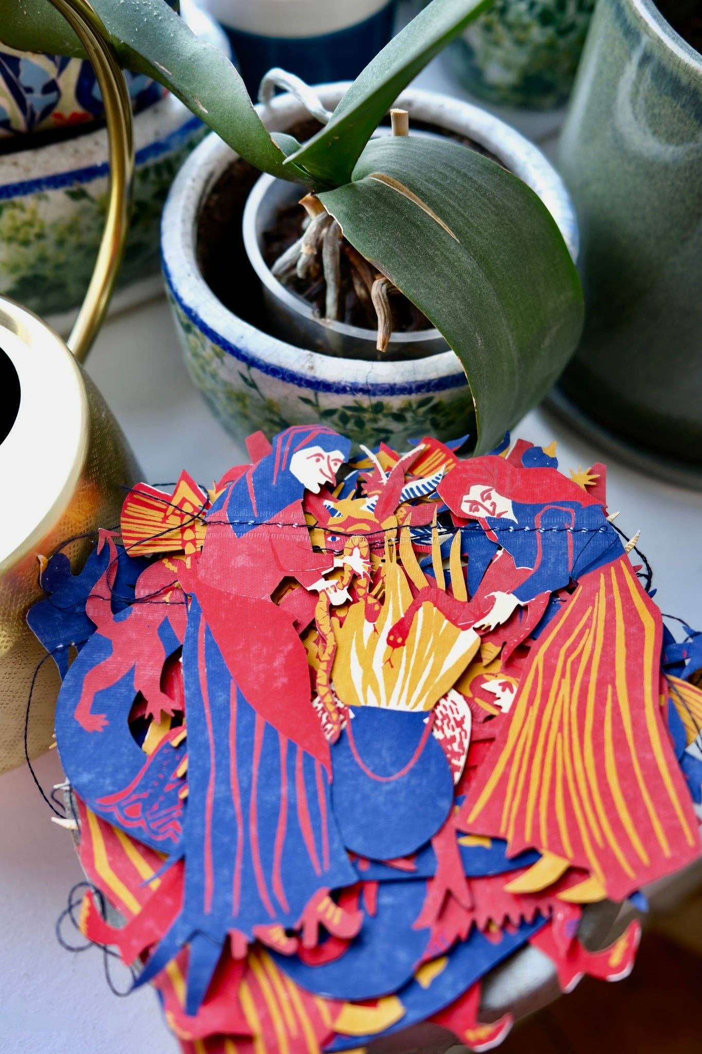Recycled paper hanging garland with witch woodcut design