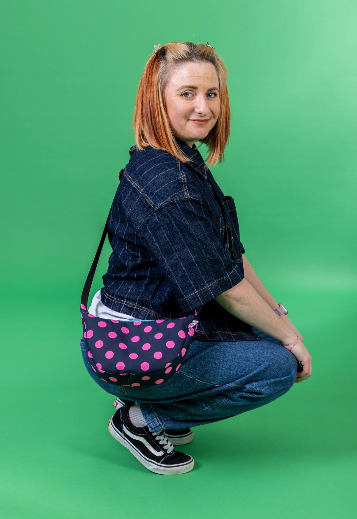 Interior of the polka dot sling bag showing phone pocket