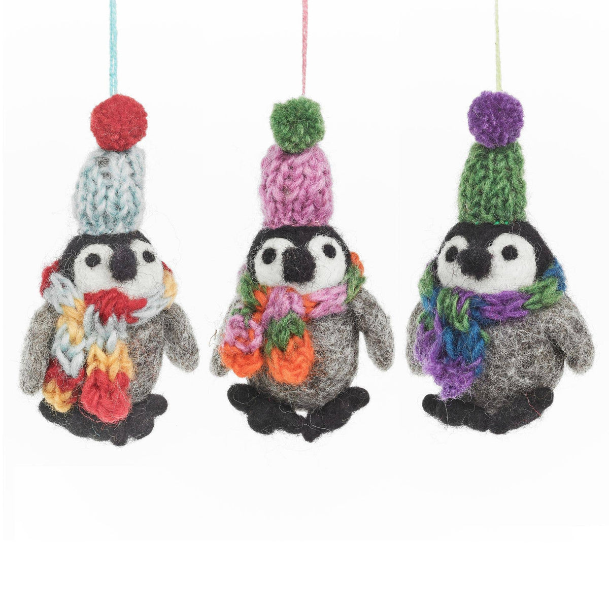 Handmade felt frosty penguin wearing colourful knitted hat and scarf