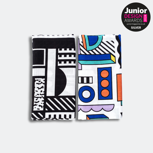 Pair of large sensory muslin squares featuring bold high-contrast designs by Camille Walala for Etta Loves, made from 100% organic cotton, suitable from 0–12 months.