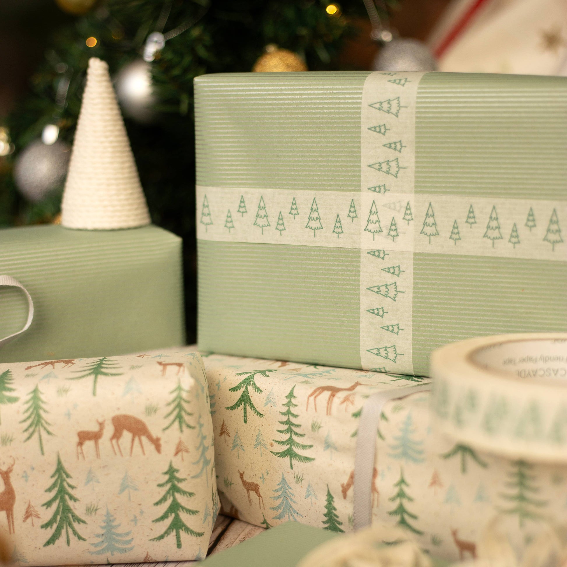 Green Christmas Tree Paper Tape on white kraft, 24mm x 50m, vegan ink, plant-based adhesive, plastic-free recyclable gift wrap tape