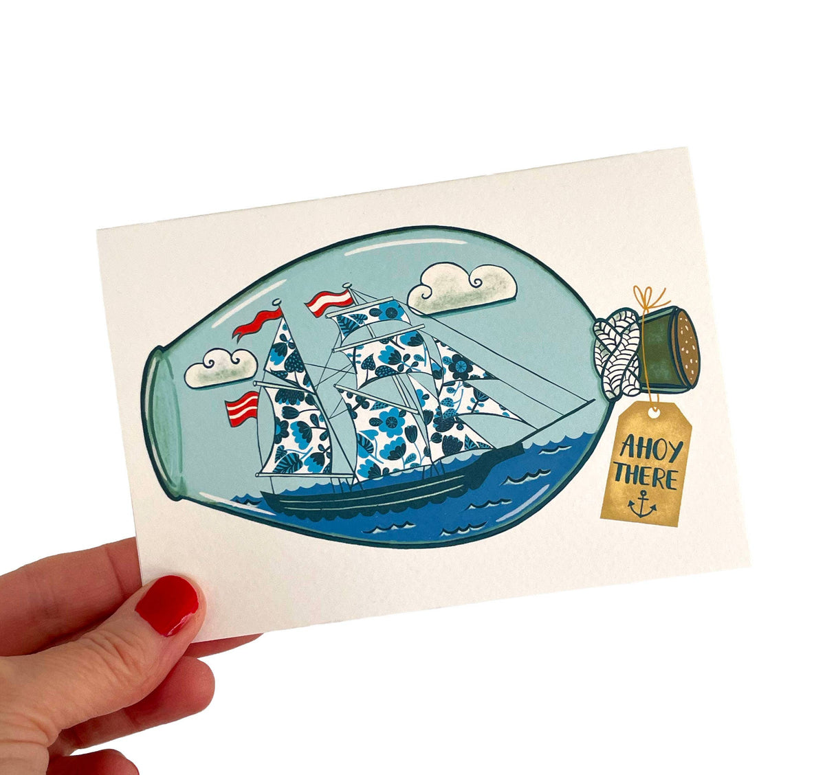 Close up of textured sustainably sourced A6 card featuring ship in a bottle illustration