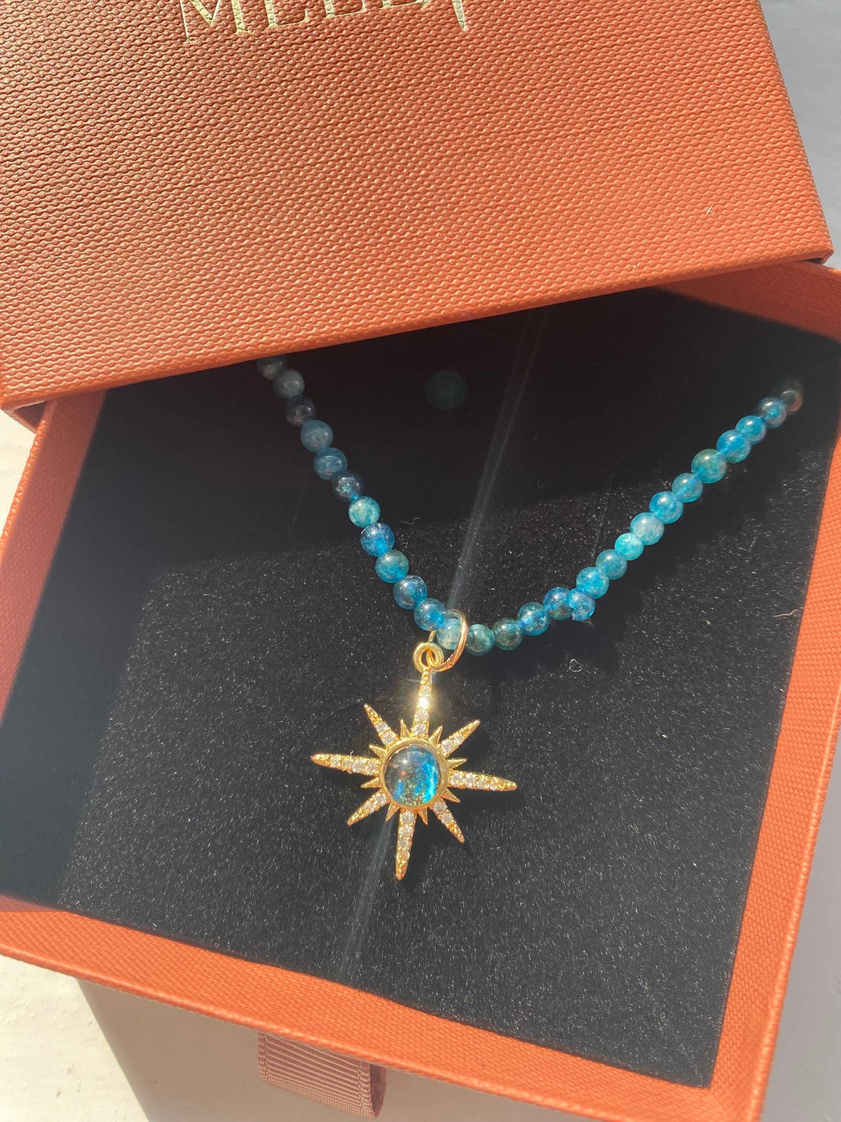 Blue beaded necklace with 18k gold plated star charm