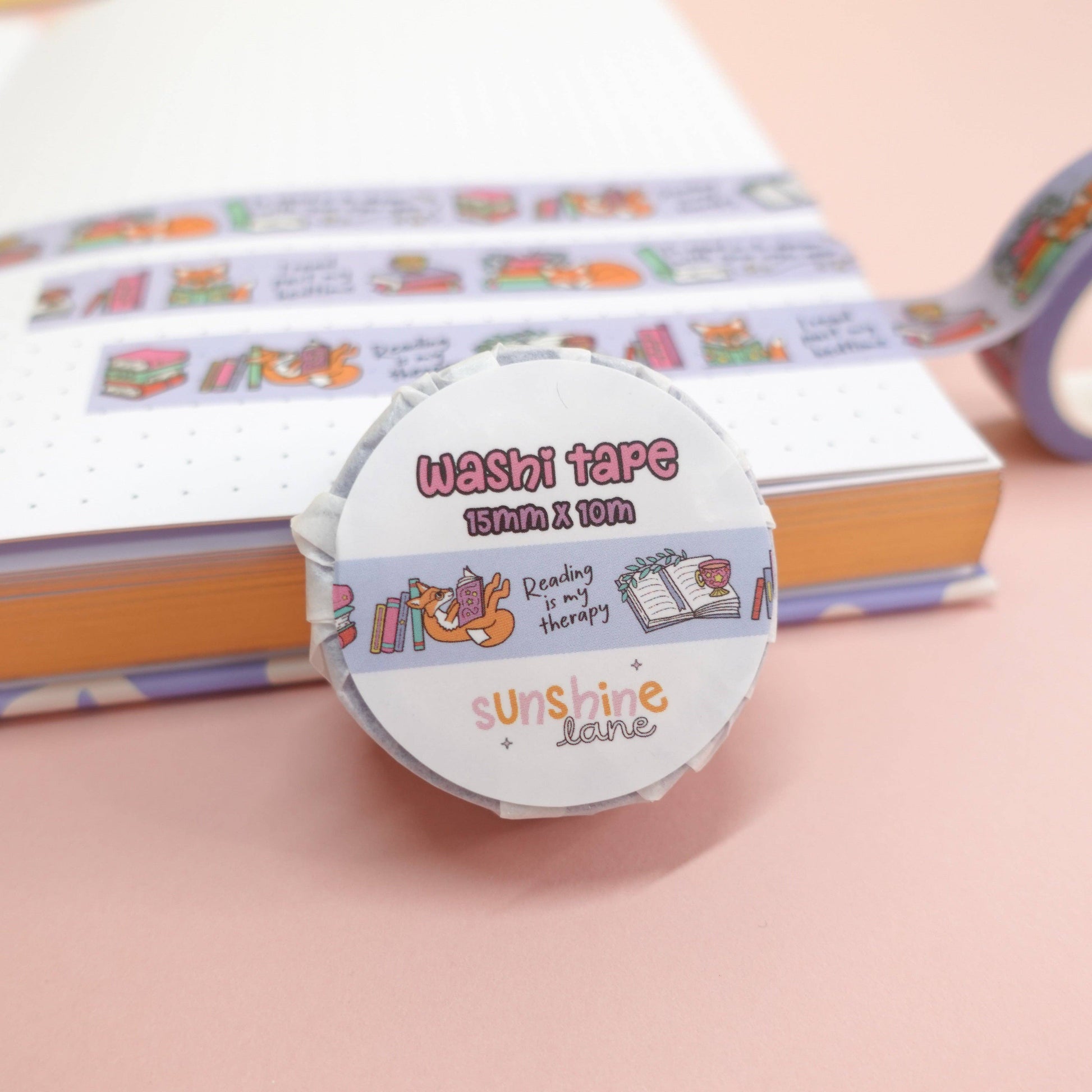 Cosy washi tape with Maple the Fox and bookish illustrations, fun reading quotes, eco-friendly paper packaging—great for planners, crafts, and gifts.