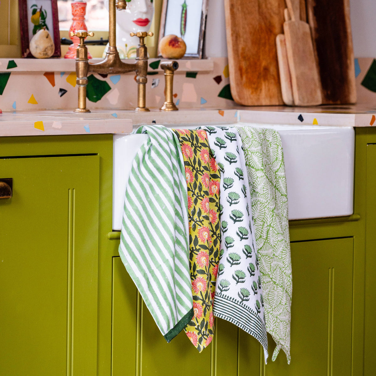 Handmade green stripe cotton tea towel folded neatly
