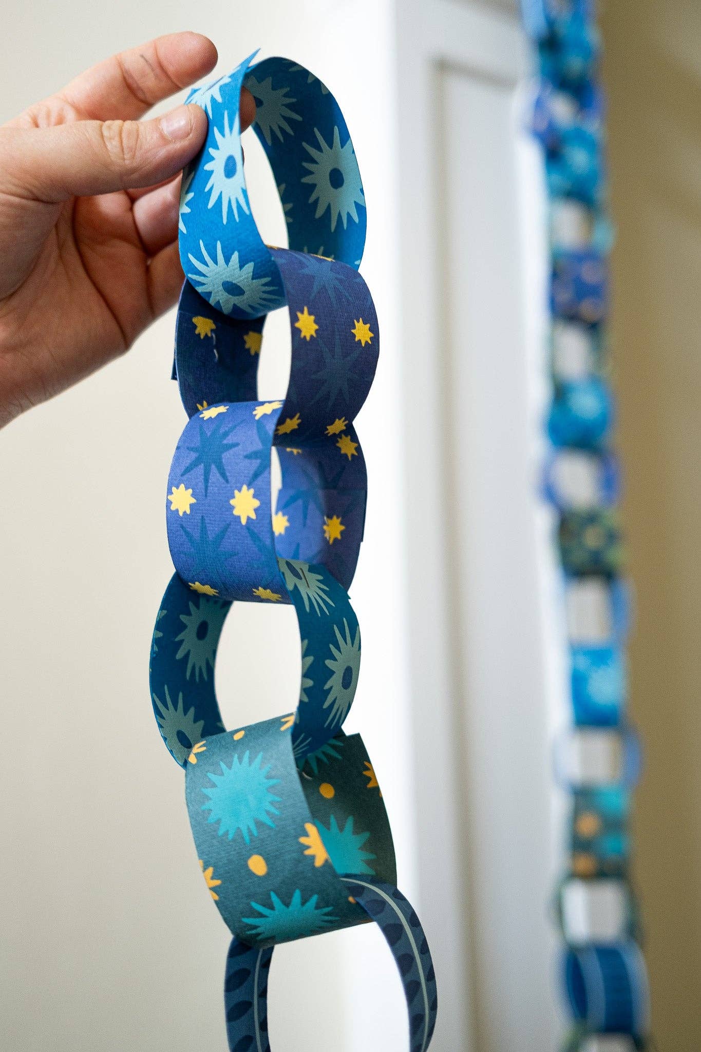 Eco-conscious blue and yellow paper chain kit packaging