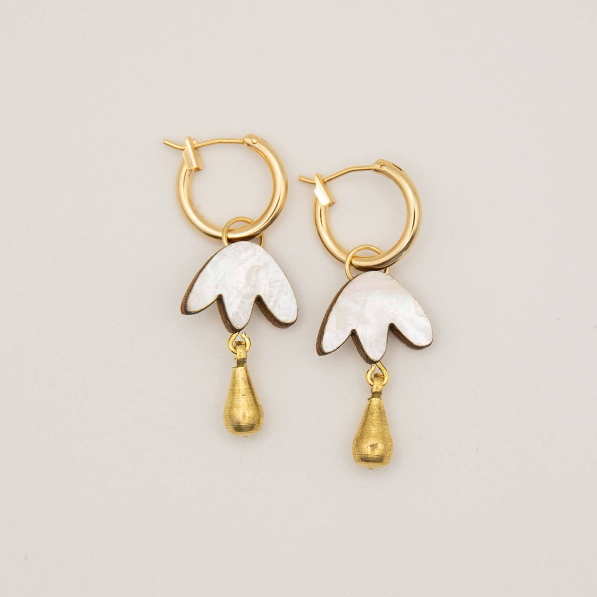 Close up of shell petal drop on 15mm gold hoop