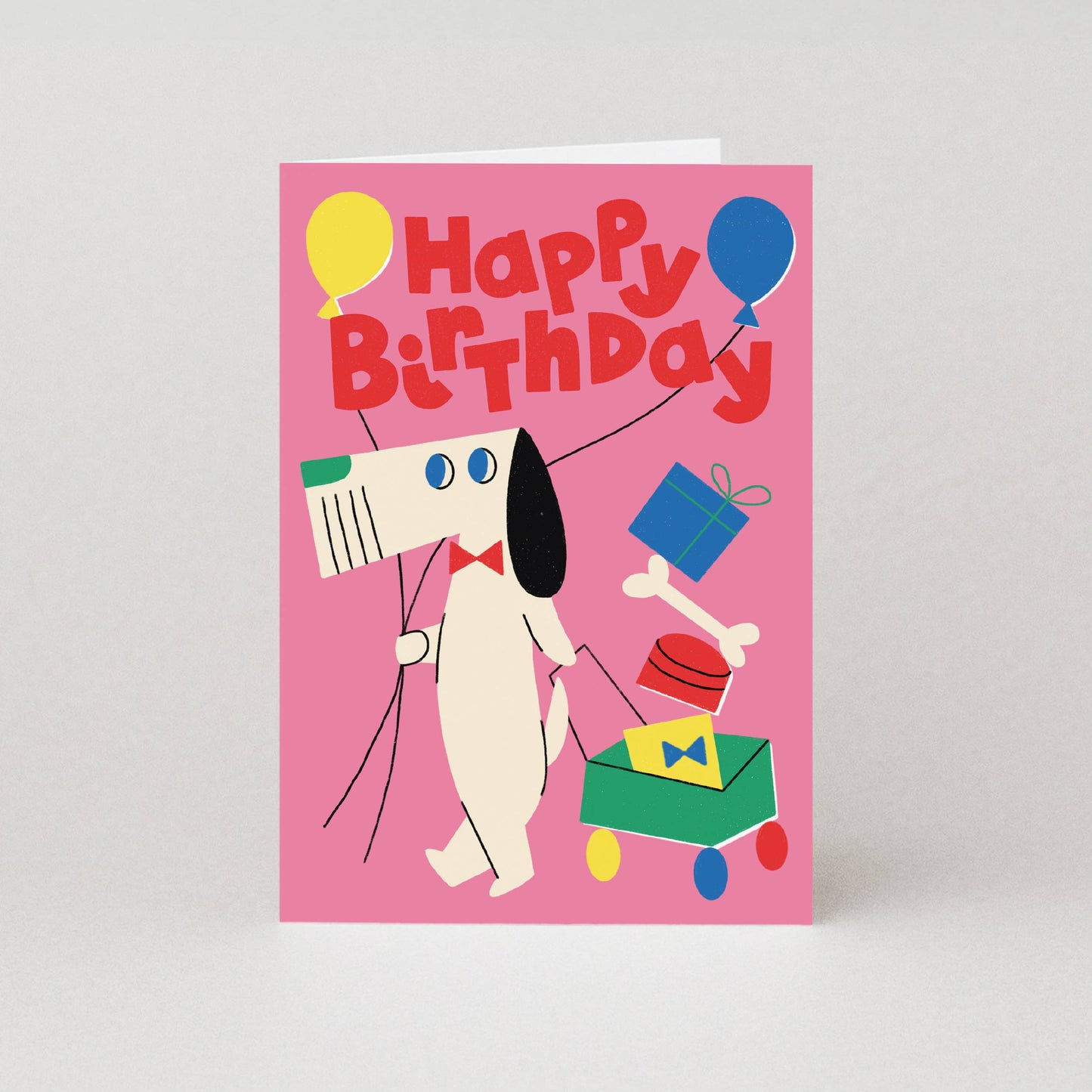 Cubist dog birthday card featuring a dog with balloons and a wagon