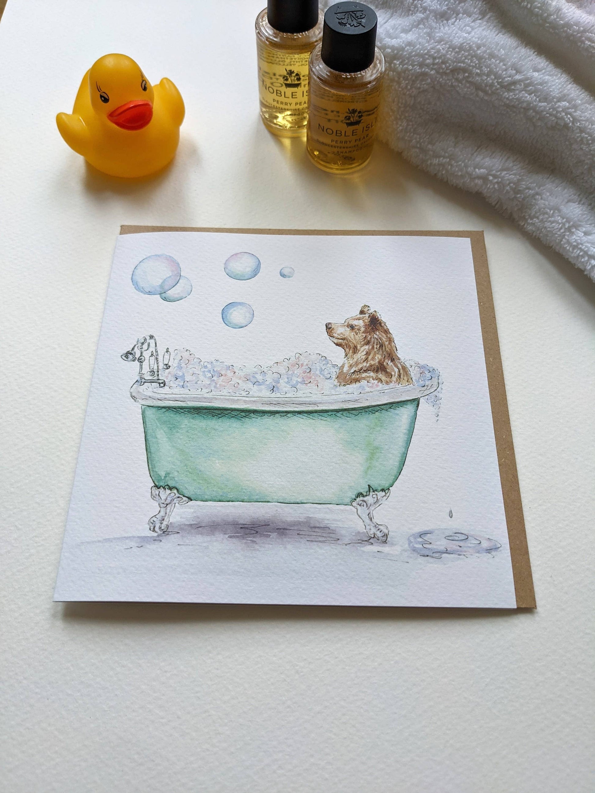 Bear in Bath card displayed on a shelf
