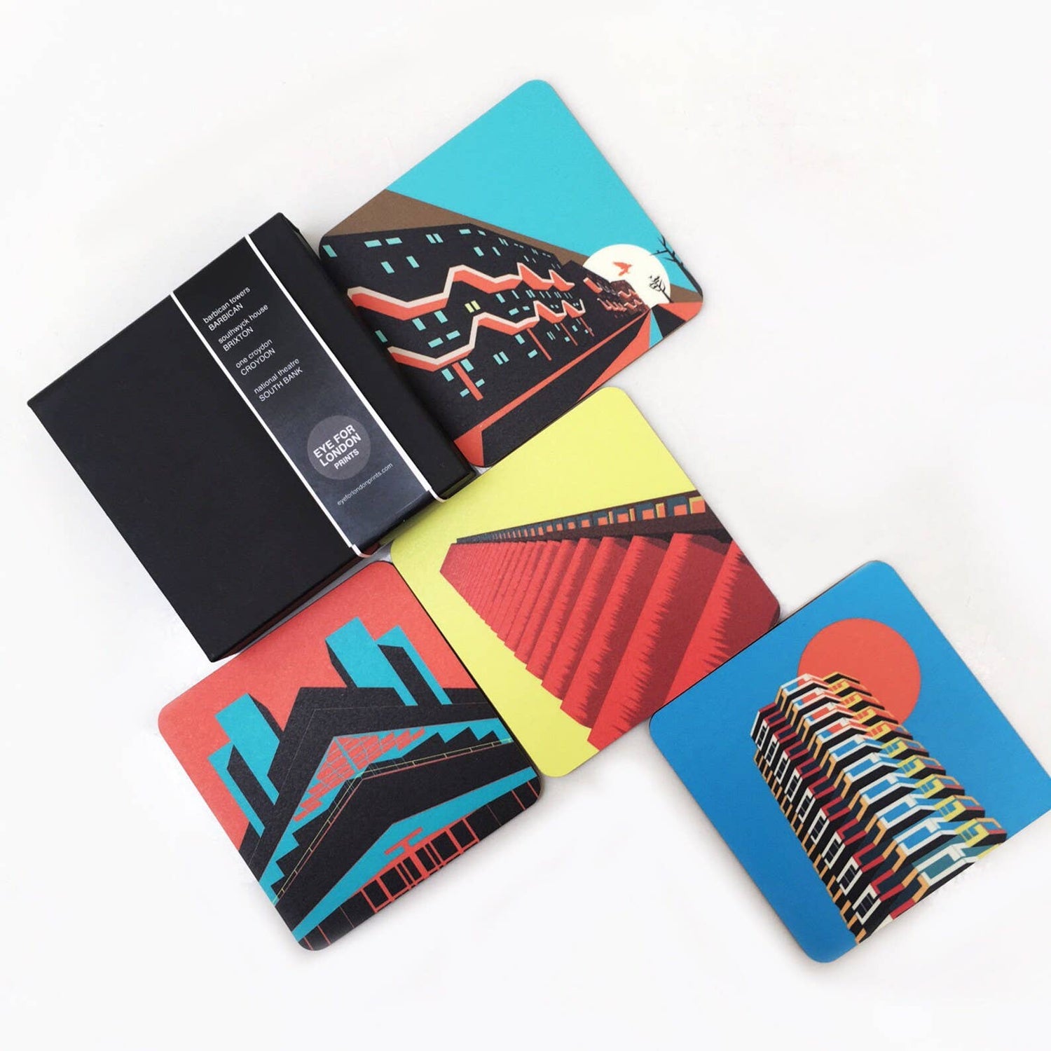 Brutalist London Coaster Set. Brutalist London Coaster Set. Set of 4 coasters featuring London Landmarks. Prints of Barbican, Brixton, Croydon and National Theatre. These coasters feature some of the most iconic Brutalist structures of London. One Croydon, the Barbican Tower, Southwyck House, Brixton and the National Theatre in South Bank.

Specs: The coasters measure 10 x 10cm, about 5mm thick. Cork backed hardboard, and matte laminated finish.

They come in a smart, minimal black match-box style packaging