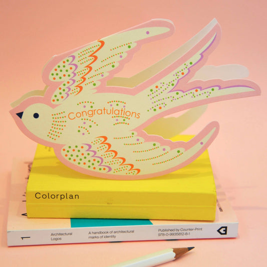 Whimsical rocking bird congratulations card in baby pink