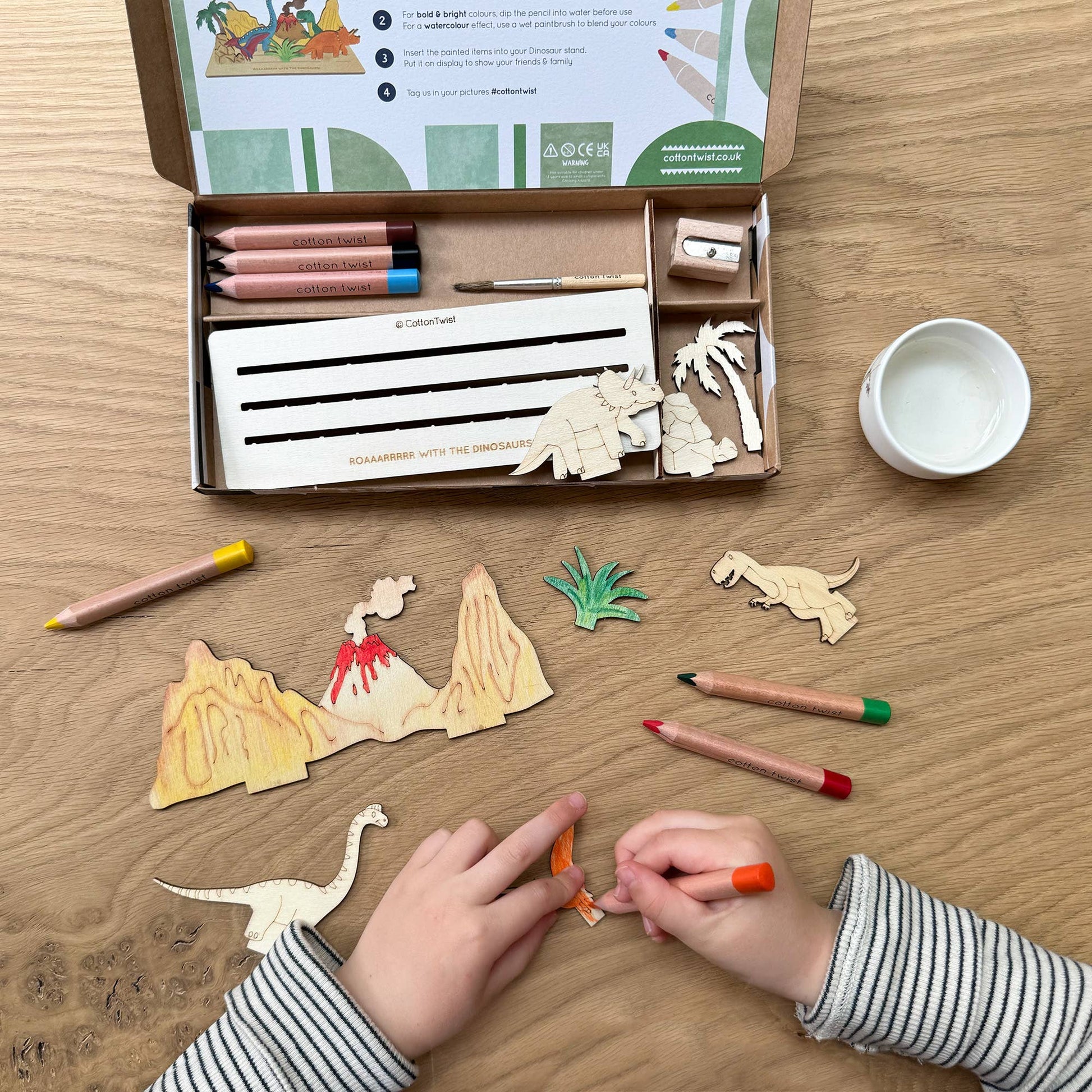 This craft kit is perfect for those who love to be creative, those who love dinosaurs (who doesn't!). Inside, discover a collection of wooden pieces, each intricately designed to spark creativity, including the mighty T-Rex, a triceratops, pterodactyl and a brachiosaurus. With wooden parts of all your favourite dinosaurs, plus scenery, the watercolour pencils &amp; paintbrush included allow for detailed ; precise painting with the ability to mix colours. Once painted, simply add the wooden parts 