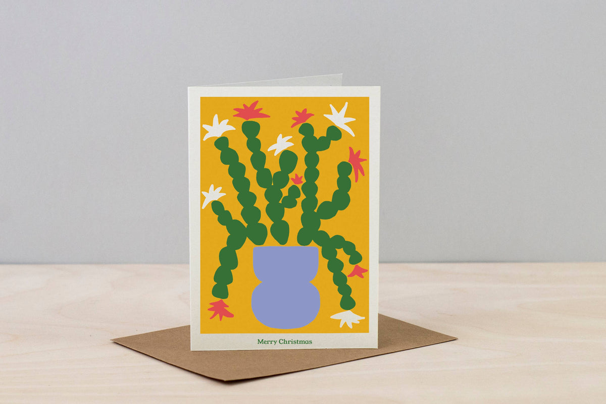 A6 Christmas plant card featuring a festive poinsettia design