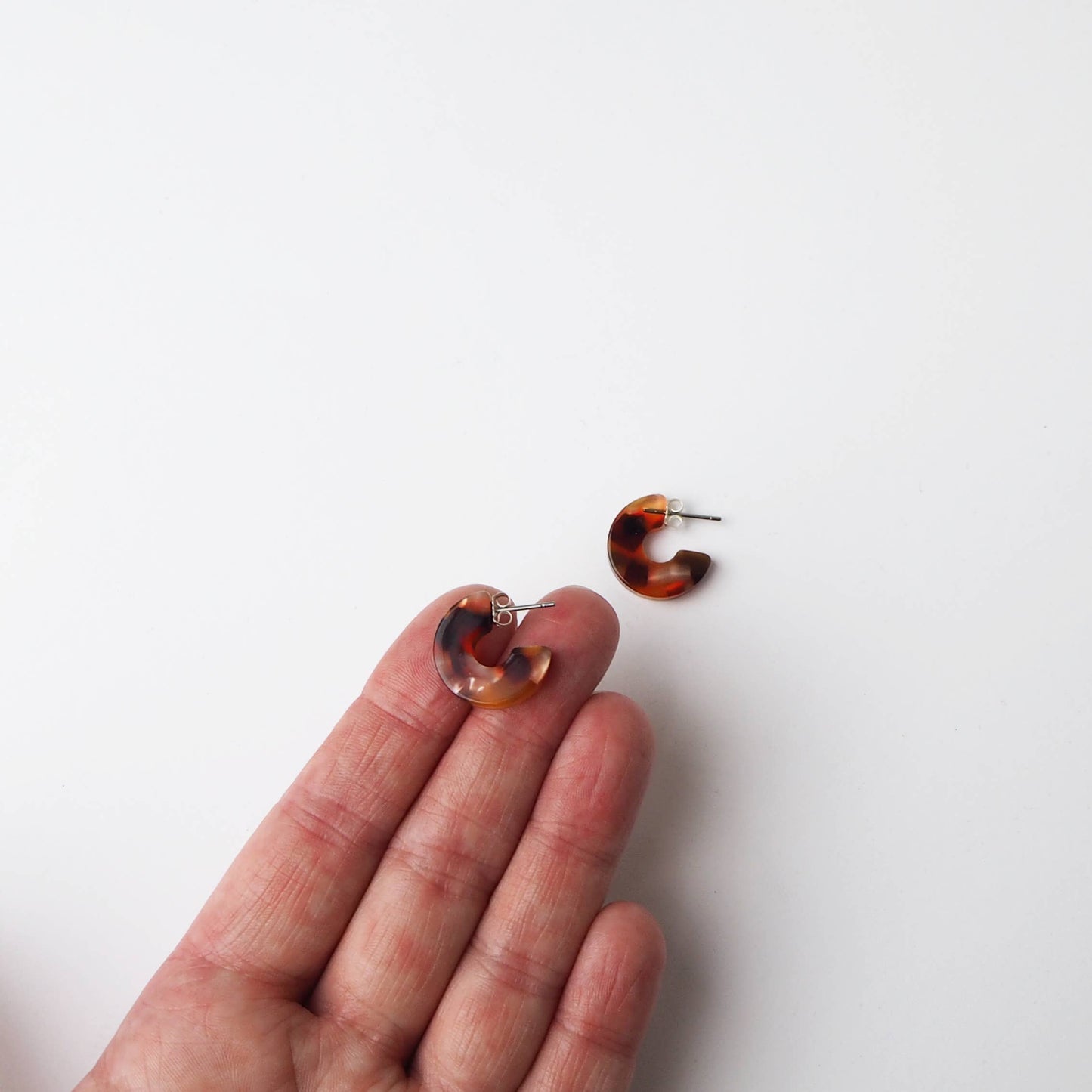 Close up of tortoiseshell pattern on hoop earrings