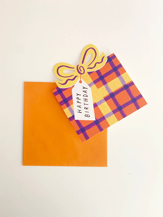 Colourful Kitty Kenda birthday card with plaid bow design and orange envelope