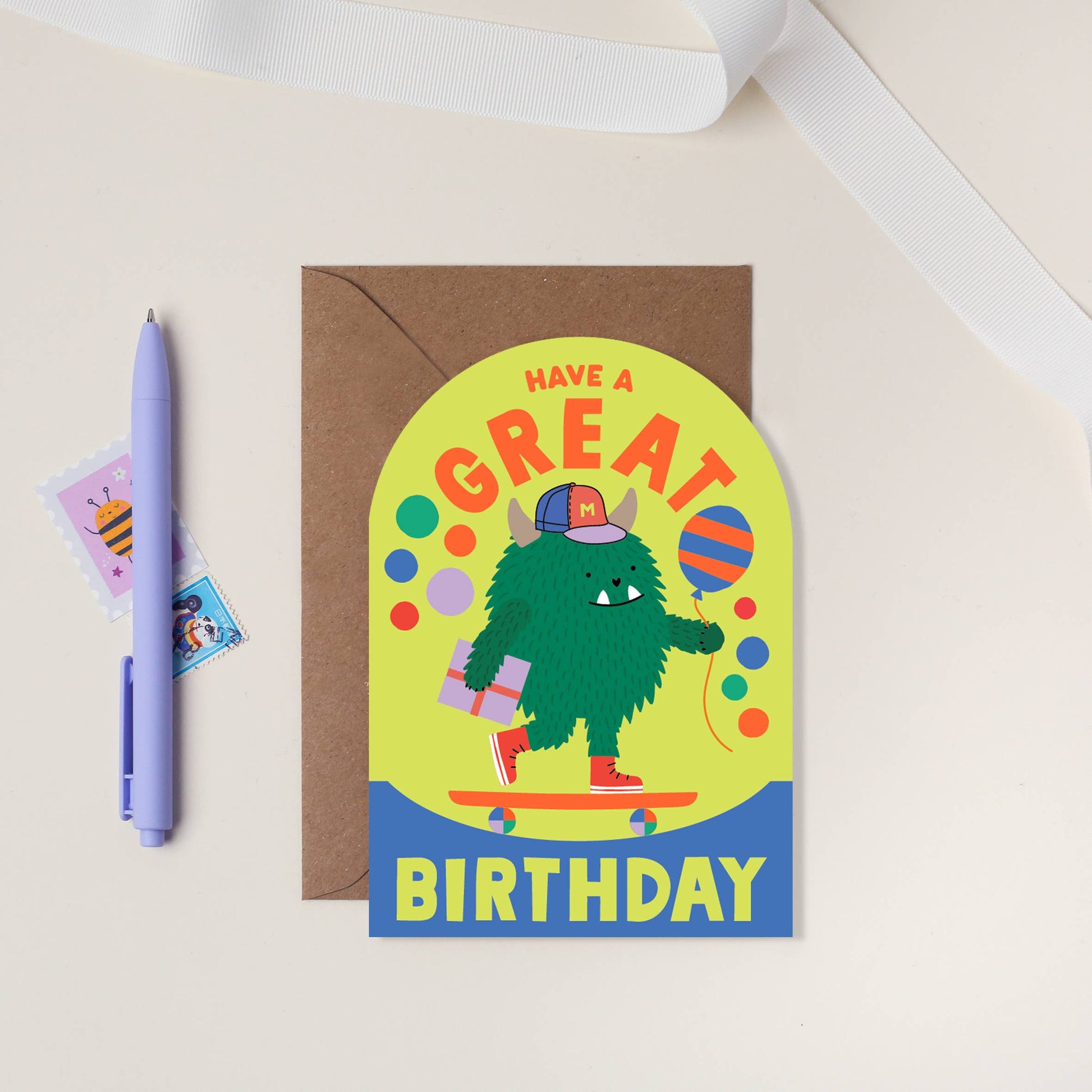 Skateboarding monster kids birthday card with neon ink and arched shape