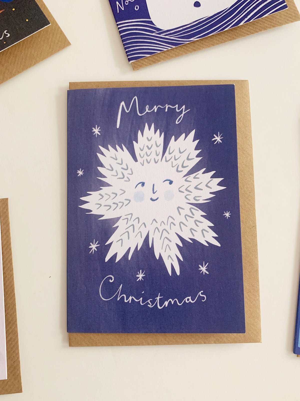 Smiling Snowflake Christmas Greeting Card by Kitty Kenda on sustainably sourced paper