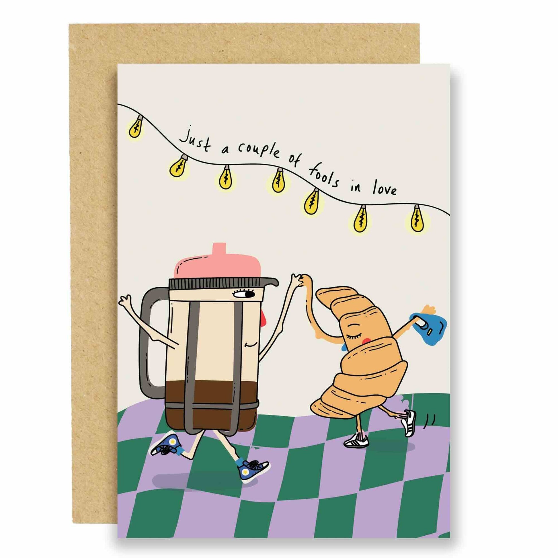 Whimsical 'Fools in Love' card: dancing coffee pot & croissant. Ideal for anniversaries, Valentine's, or love notes. Sustainably sourced.