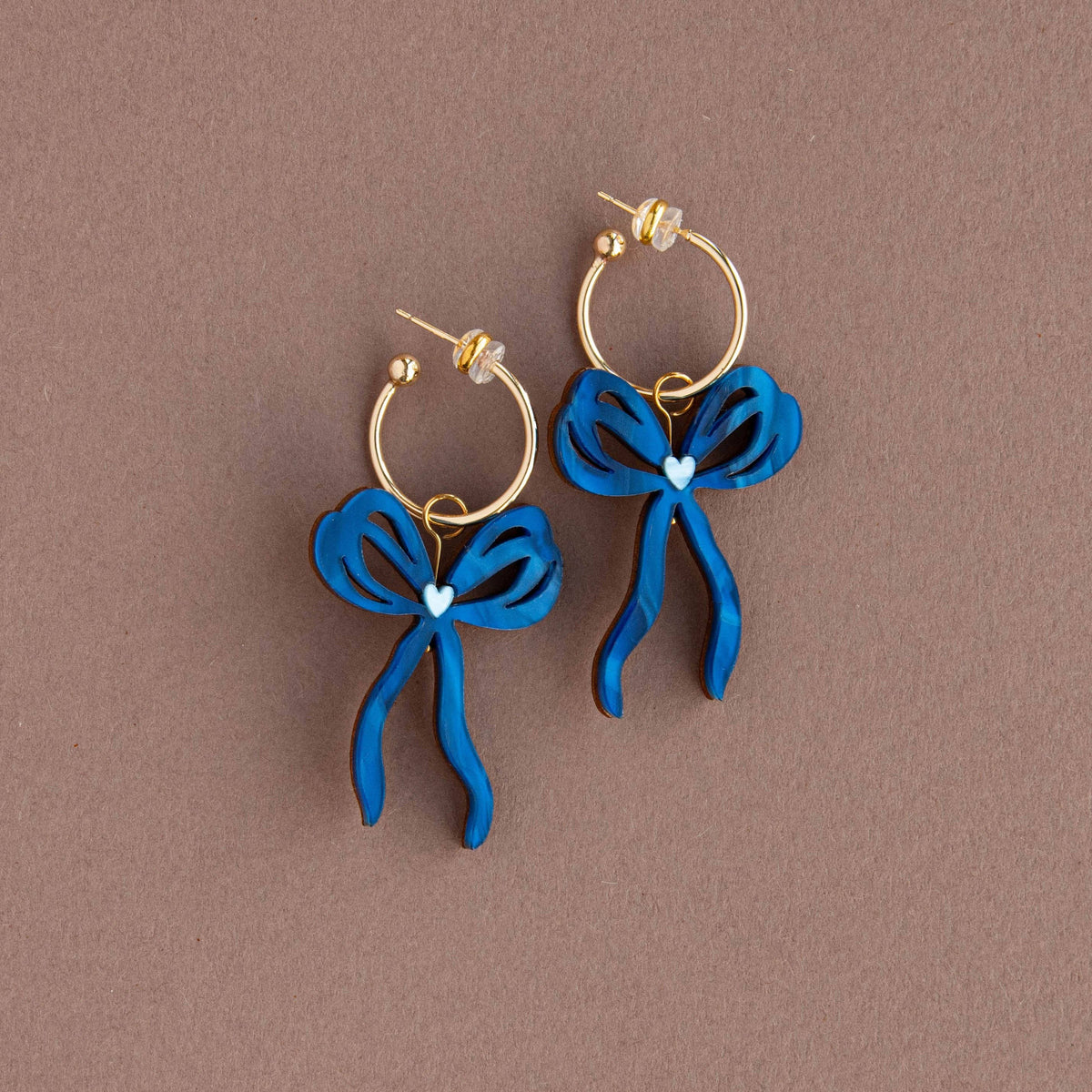 Handmade oversized bow hoop earrings with heart detailing