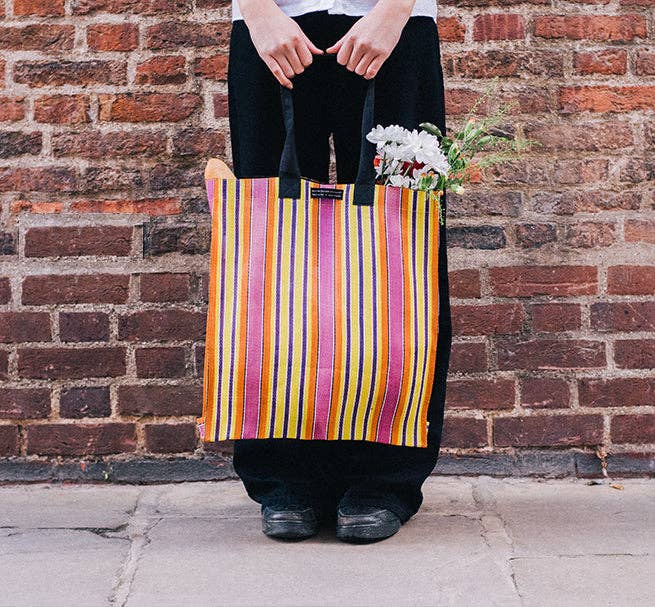 Eco Woven Market Shopper in Neyron, Guardsman and Pearl. A colourful, sustainable shopper with sturdy handles and a magnetic popper closure. This bag is made from threads spun from recycling old cement sacks!