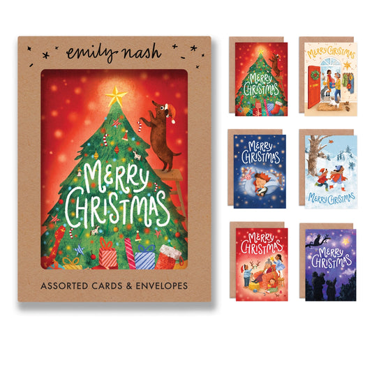 Box set of six A6 illustrated Christmas cards by Emily Nash, each featuring a different festive family scene, with recycled kraft envelopes in a cardboard presentation box.