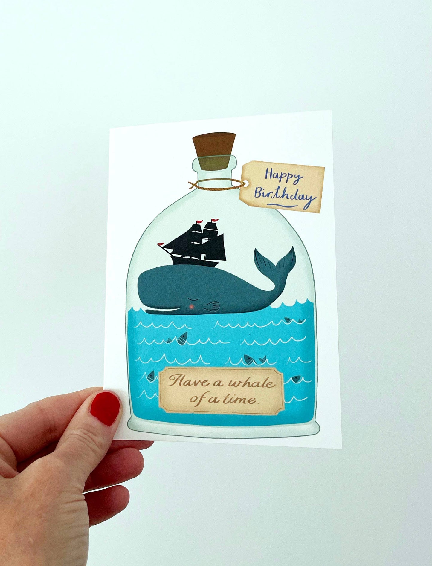 A6 Whale of a Time birthday card shown with its kraft paper envelope