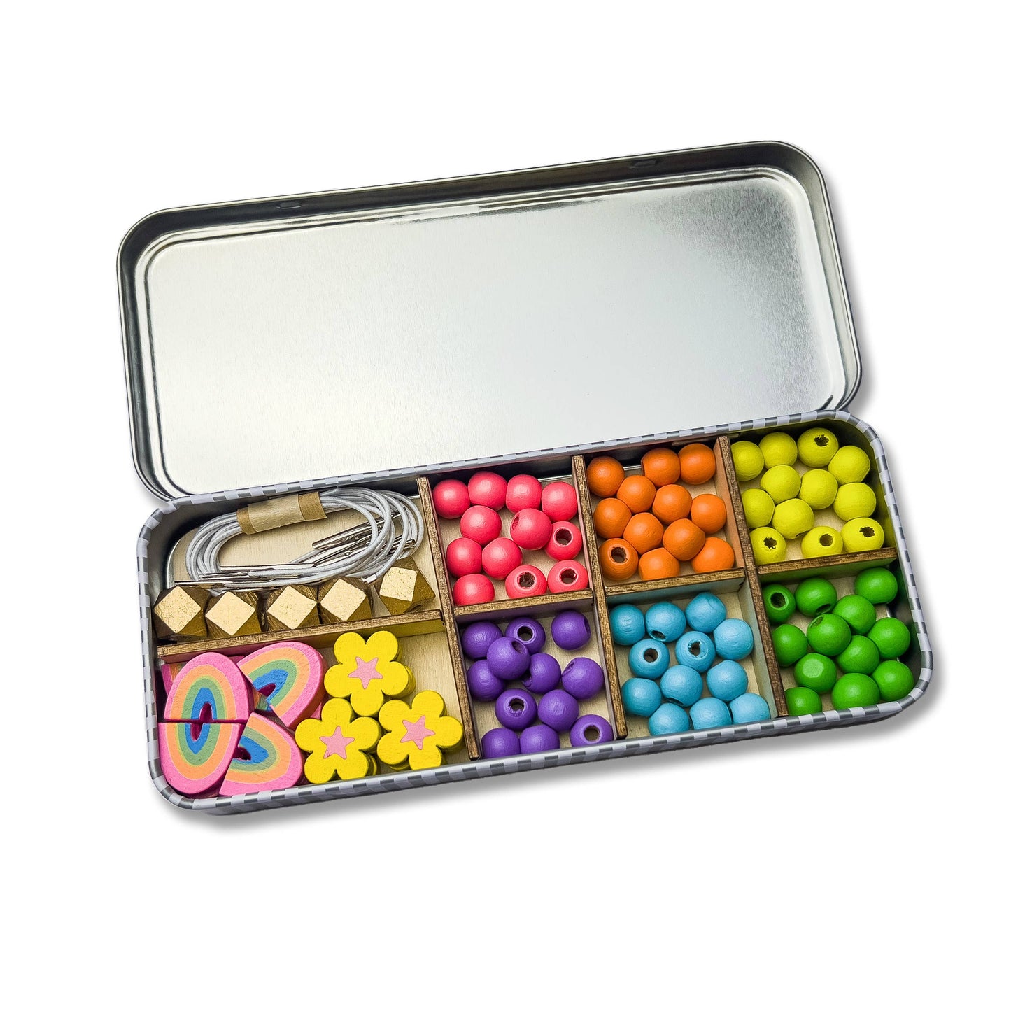 Child's hands threading colourful wooden beads from the Cotton Twist Rainbow Kit