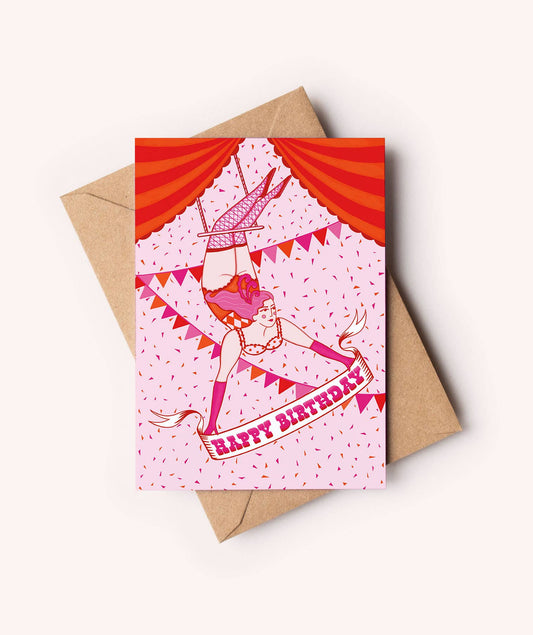 Circus Birthday Card A6 with trapeze artist illustration by Su Owen printed on sustainable Perlino Cotton paper, textured off-white sustainable certified board, UK made